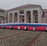 Волонтеры развернули большой российский флаг в Новой Каховке - Херсонка.ру