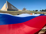 Офицеры СУ СК России по Херсонской области приняли участие в акции, посвященной Дню Государственного флага России
